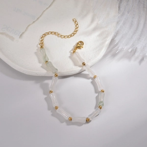 Minimalist bamboo-shaped stone bead bracelet with gold accents and extension chain