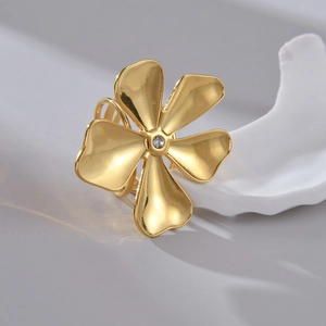Minimalist golden flower ring with five petals and a sparkling center zircon on white base