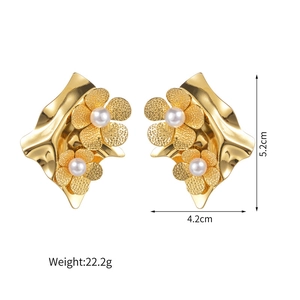 Detailed view of gold flower earrings with white pearls and size measurements shown