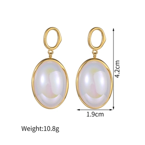 Detailed view of heart-shaped earrings with shell inlay including size measurements