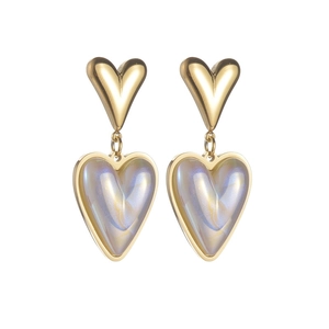 Macro view of gold heart earrings featuring iridescent shell-like resin inlays