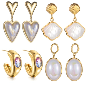 Set of four gold stainless steel earrings featuring hearts, shells and pearls