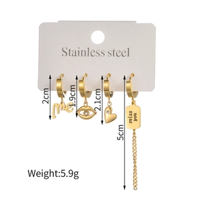 Set of four gold stainless steel heart and letter charms earrings on display card