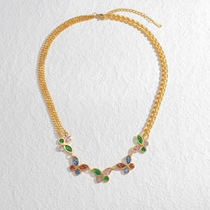 Gold butterfly pendant necklace with multi-colored crystals and asymmetric chain links