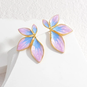 Pink and blue gradient leaf earrings with gold metal frame on a white stone base