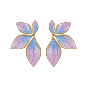 Detailed macro view of asymmetric floral earrings with lavender enamel and gold finish