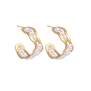 Minimalist gold wavy pearl earrings with double curved metal design and white beads