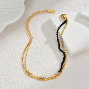 Collana a doppio strato in acciaio inossidabile dorato con perline nere e perle bianche