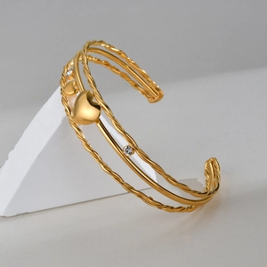 Gold-plated stainless steel layered open cuff bracelet with heart charms and zircons
