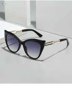 Detail of cat eye sunglasses with gold hollow temples and gradient purple lenses