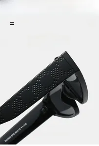 Detailed macro view of black sunglasses temple with embossed texture and model ZN9800