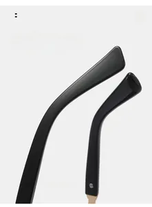 Macro shot of curved black glossy sunglasses legs designed for comfortable wear