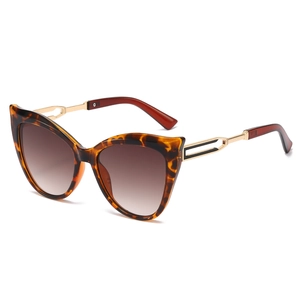 Classic tortoise shell cat eye sunglasses with gold hollow metal temples and gradient lenses