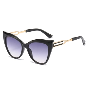 Chic cat-eye sunglasses with purple gradient lenses and hollow golden metal temples
