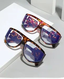 Detail of oversized anti-blue light glasses with colorful stone and tortoise shell patterns
