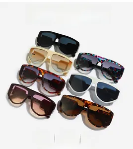 Macro display of oversized flat top shield sunglasses in multiple trendy colors