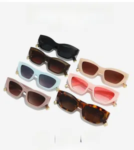 Detailed arrangement of seven retro cat-eye sunglasses in multiple stylish colors