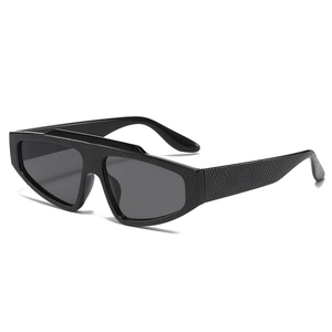 Irregular chunky frame sunglasses with dotted monogram pattern and dark lenses