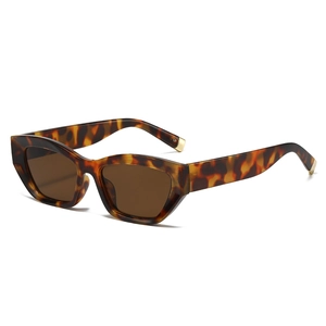 Retro cat eye tortoise sunglasses with dark brown lenses and gold metal temple tips