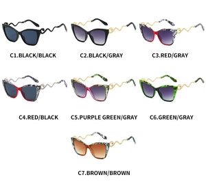 Detailed display of cat eye sunglasses with golden snake-shaped metallic temples in seven colors