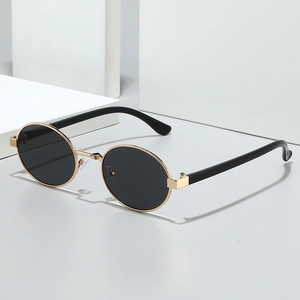 Retro oval metal sunglasses with gold frame and dark grey lenses for women