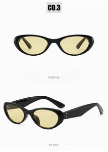 Gros plan sur des lunettes de soleil ovales noires avec verres jaunes transparents