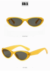 Vue de face et de profil à 45 degrés de lunettes de soleil ovales jaunes à verres gris