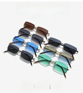 Detail shot of rimless rectangular sunglasses in multiple vibrant colors and gold frames