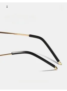 Close-up of curved metal eyeglass temples with ergonomic black tips for comfort