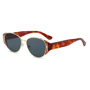 Vintage tortoiseshell sunglasses with golden H-hinge detail and dark lenses