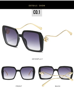 Detailansicht der großen quadratischen Sonnenbrille mit lila Verlauf und Perlenbügeln