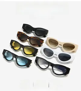 Flat lay of retro cat eye sunglasses in seven various colors with a glossy frame finish