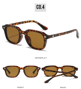 Gros plan sur des lunettes de soleil carrées avec monture écaillée et rivets métalliques