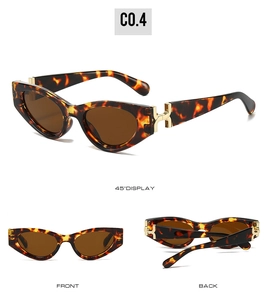 Detail of tortoise shell sunglasses with gold H hardware and dark brown lenses