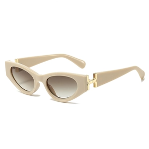 Chic cat-eye sunglasses with beige frames, gradient lenses, and golden H-shaped hardware