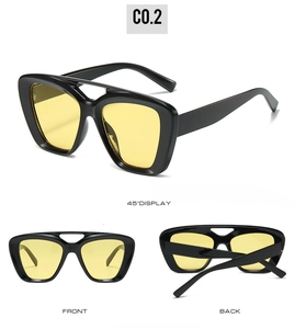Detailed views of double bridge oversized sunglasses with black frame and yellow lenses
