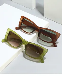Macro shot of retro square cat-eye sunglasses with gradient lenses on stone display