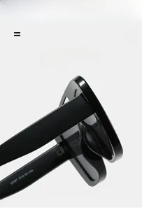 Detailed macro view of the reinforced metal hinges and premium frame texture of the sunglasses