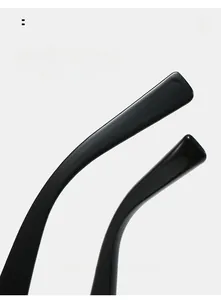 Detail of glossy black temples on Y2K sunglasses highlighting smooth ergonomic curved design
