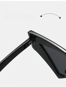 Detail of durable metal hinges on oversized black sunglasses with premium finish