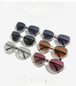 Detail showing various colors of half-frame cat-eye sunglasses with pearl embellishments