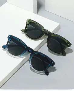 Detail of square sunglasses with silver arrow metal studs and transparent resin frames