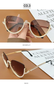 Detail of cat-eye sunglasses featuring pearl embellishments and brown gradient lenses