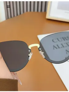 Detail of comfortable clear soft nose pads on metal bridge of semi-rimless sunglasses