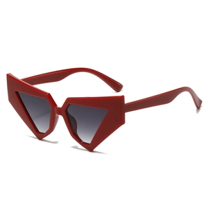 Modern red geometric sunglasses with grey gradient lenses and wide avant-garde frames