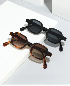 Detail view of square black and tortoise shell frames with blue light blocking lenses
