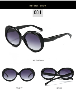 Vue en trois dimensions de lunettes de soleil ovales noires avec verres dégradés violets