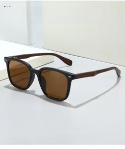 Detailed macro view of retro square sunglasses featuring brown wood grain textured temples