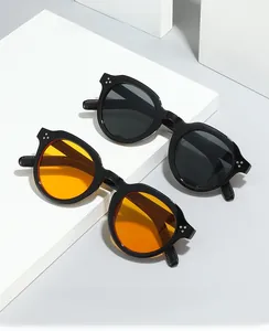 Detail of oval vintage PC sunglasses with stylish silver rivets and night vision lenses