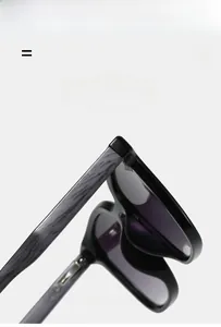 Detail of square sunglasses showing elastic faux wood grain temples and silver rivets